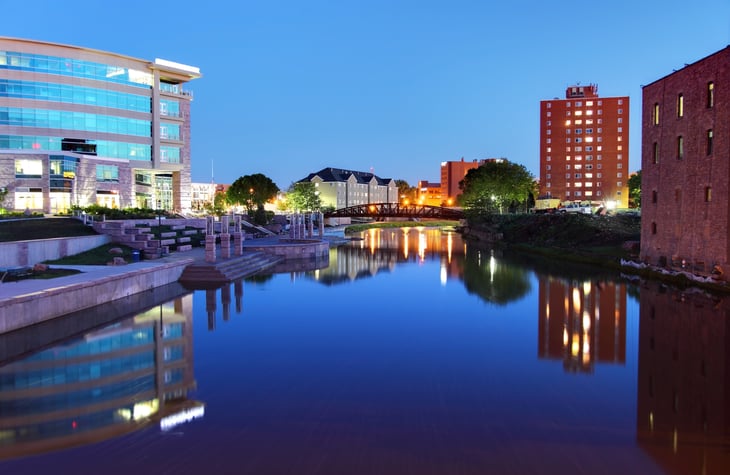 River and buildings through Sioux Falls, South Dakota.