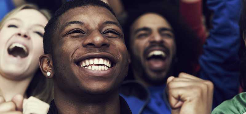 People smiling and celebrating.