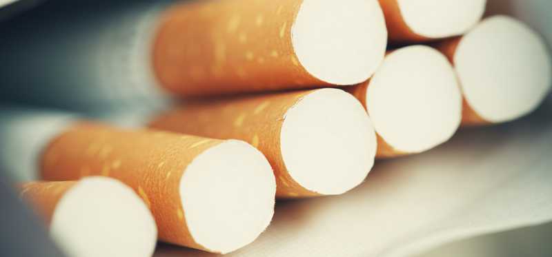 Close up of an open pack of cigarettes.