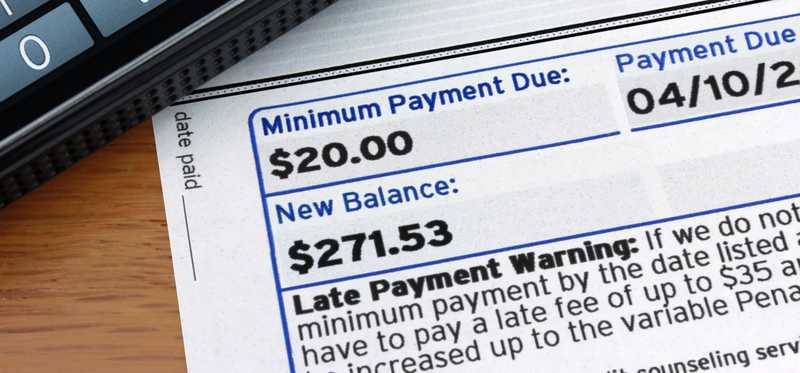 A credit card bill with minimum payment highlighted
