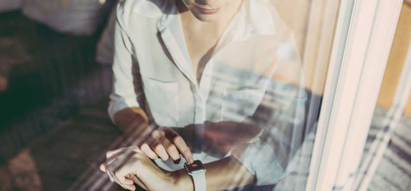 Person looking at a watch.