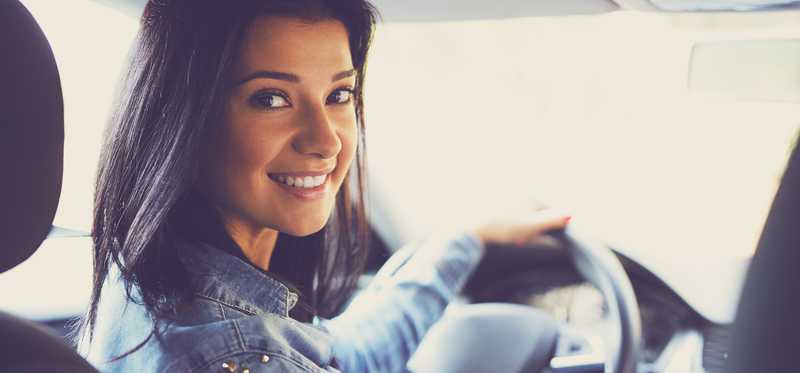 Smiling woman in a vehicle