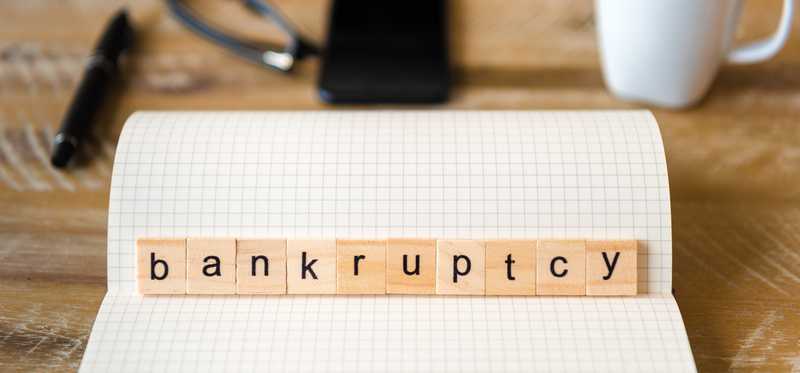 Wooden blocks spelling out the word bankruptcy.