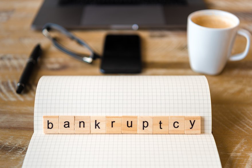 Wooden blocks spelling out the word bankruptcy.