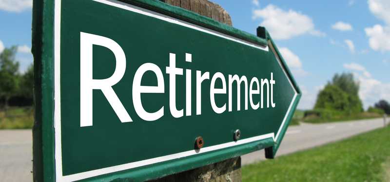 A green arrow points down a road toward retirement.