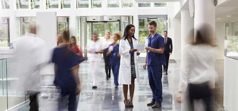 People in a hospital lobby.