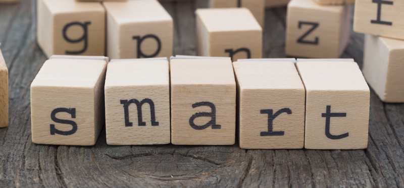 Wooden blocks spelling out the word SMART.