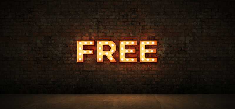 Free neon sign on brick wall.