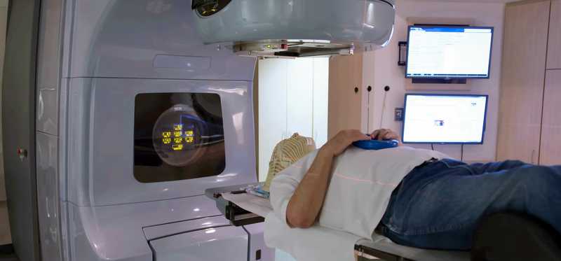A radiological machine scanning a person.