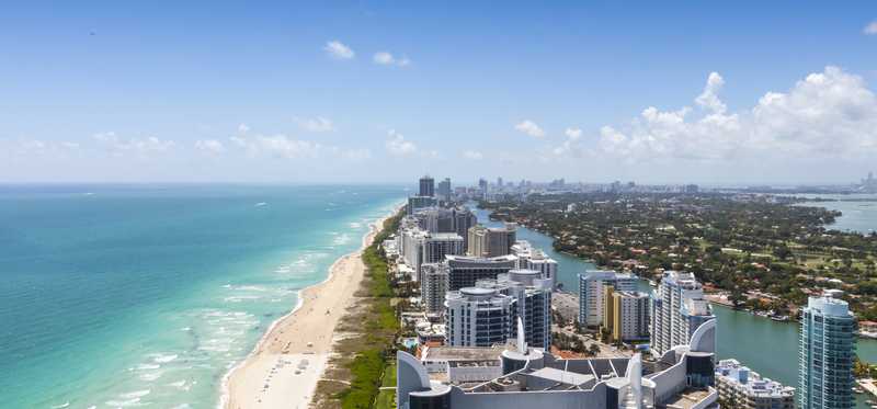 A stretch of beachfront with condos and apartments.