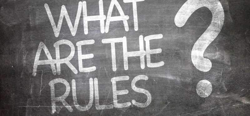 What are the rules is written in chalk on a blackboard.