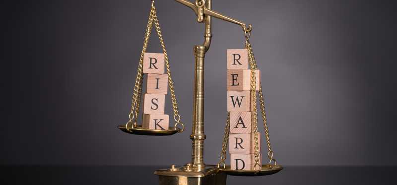 A scale weighing risk and reward.