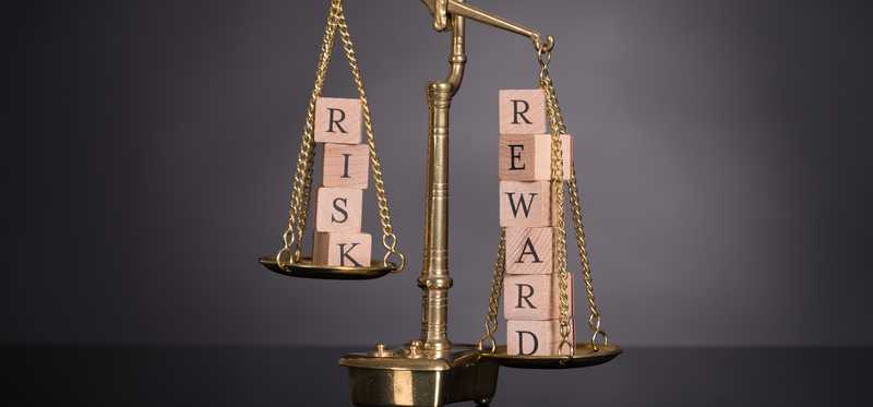 A scale weighing risk and reward.