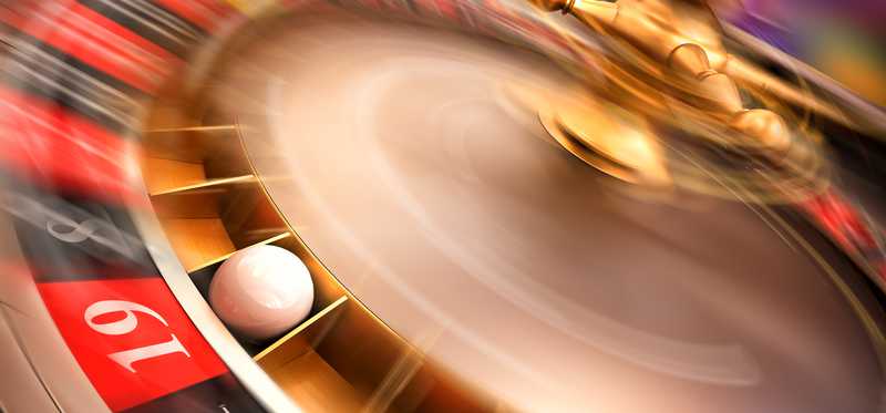 Spinning roulette wheel.