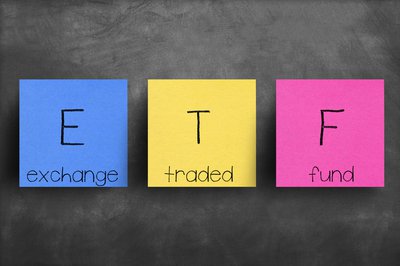 Red yellow and blue color blocks with the acronym ETF on them and the words exchange traded fund.