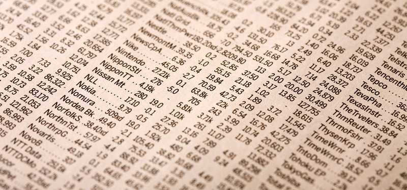 Newspaper page showing stock prices.