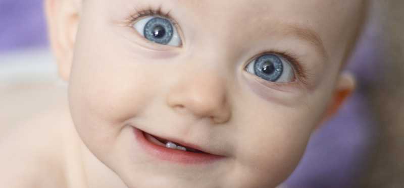 An infant with two bottom teeth.