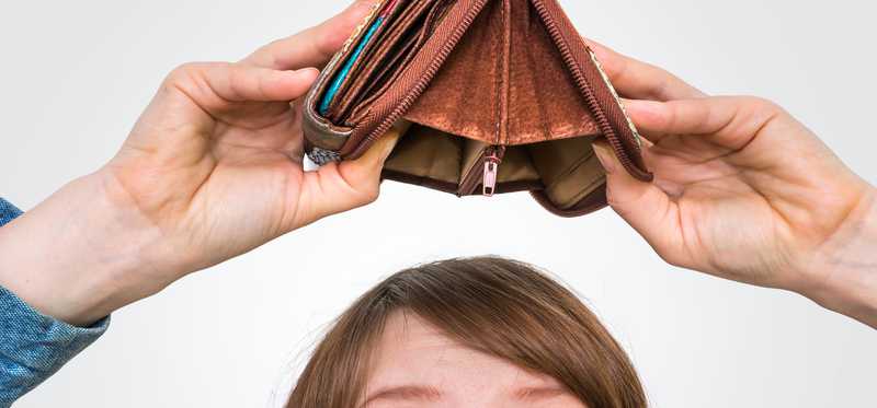 Person turning wallet upside down over head to show it's empty