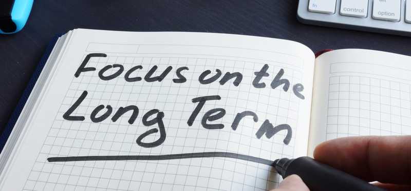 Notebook with the words Focus on the Long Term.