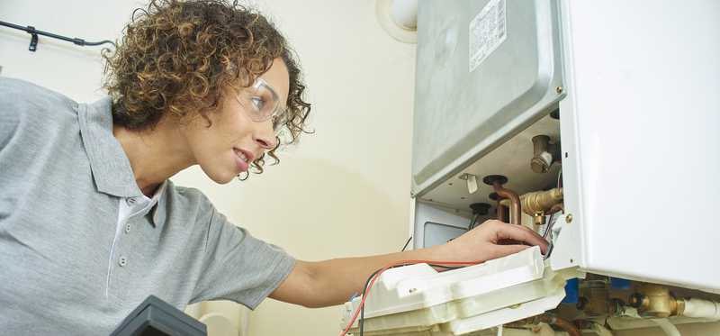 A person making a home repair.
