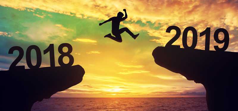 Person jumping from a cliff labeled 2018 to one labeled 2019.