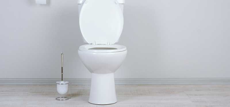 A white toilet in a bathroom.
