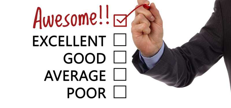 A hand checking a box next to the word Awesome on a list that also includes Poor, Average, Good, and Great.