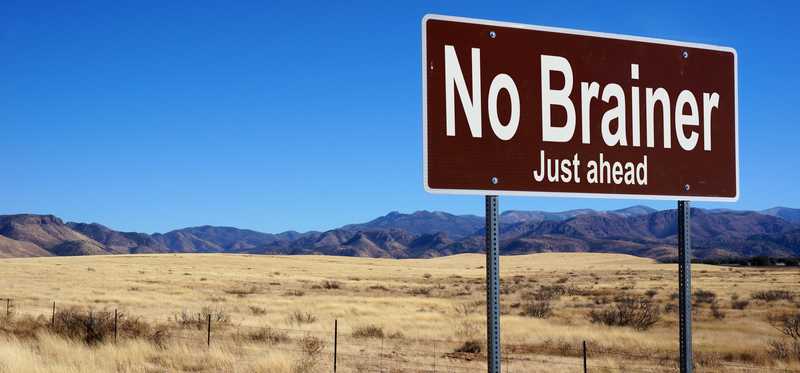 A road sign that reads No Brainer Just Ahead