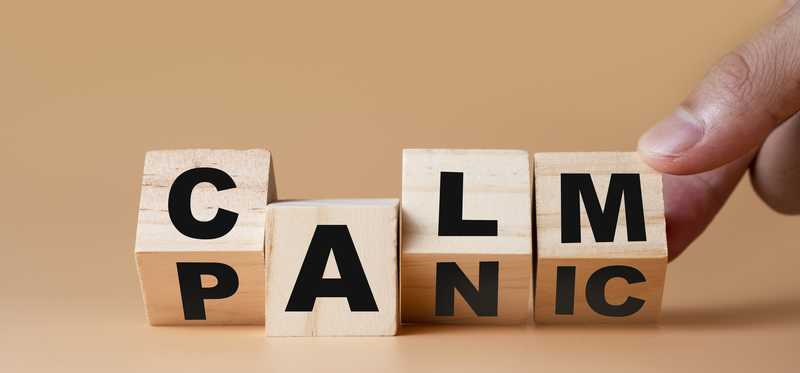 Blocks spelling out both the words Calm and Panic.