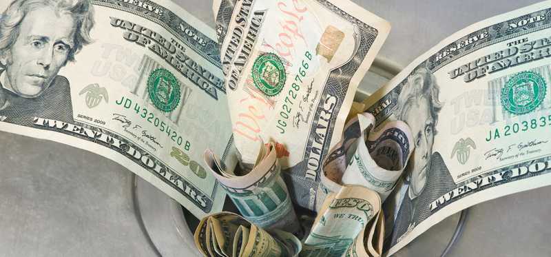 Money jammed in a drain hole.