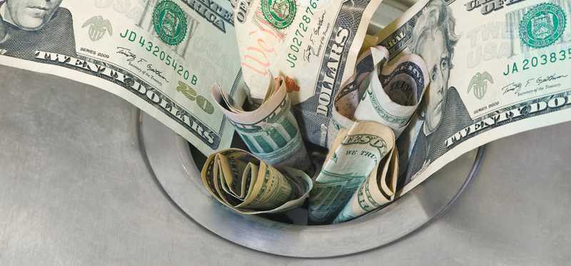 Money jammed in a drain.
