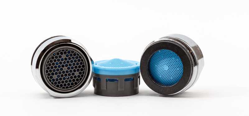 Three sink water aerators side by side.