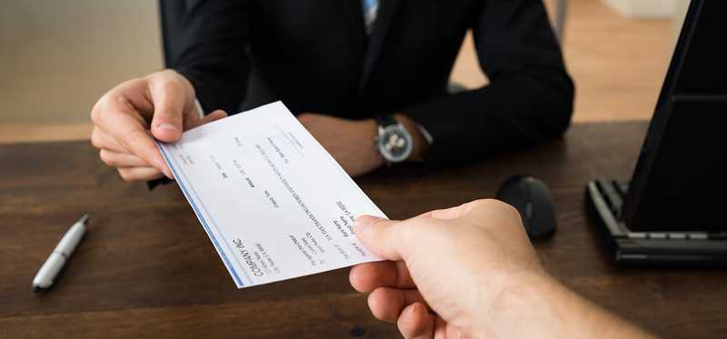 A check exchanges hands.