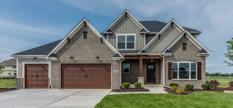 Brick home with a three-car garage.