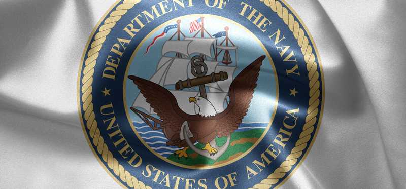 Department of the Navy crest on a shirt.
