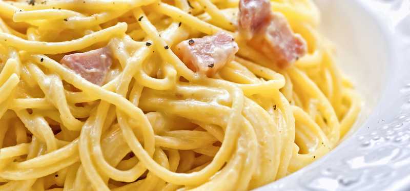 A bowl of creamy pasta.