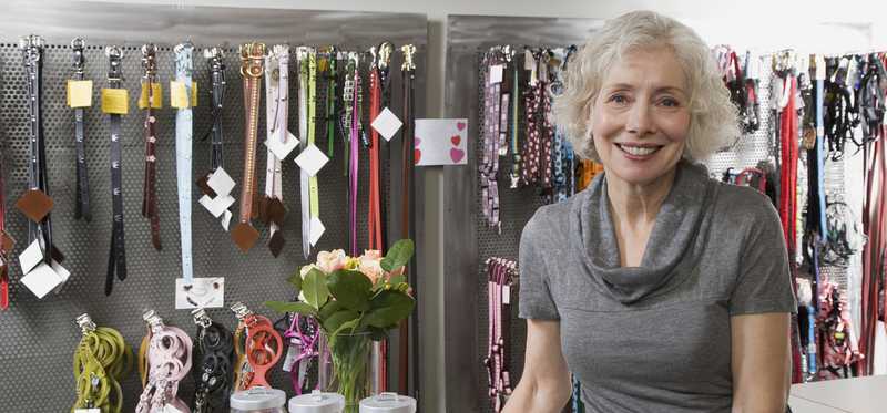 A person working behind the counter of a pet accessories store.