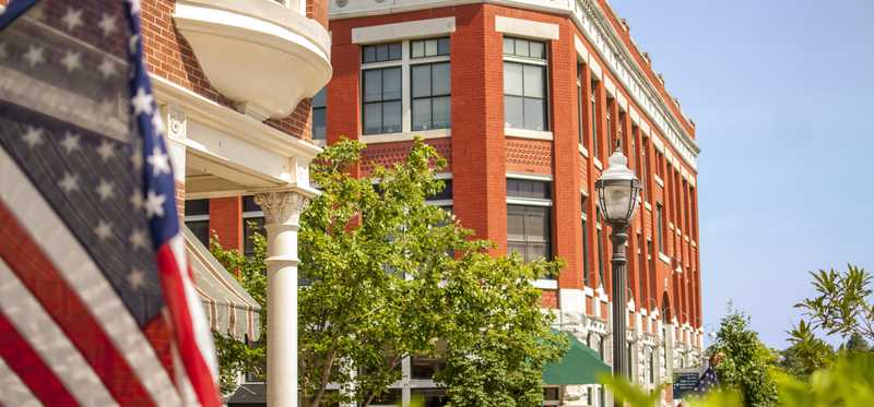 Red brick building and American flag.