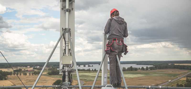 A person working on small-cell towers.