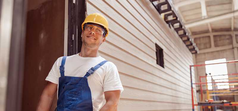 Person in a manufactured housing factory.