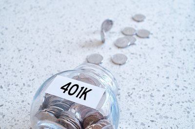 Glass jar labeled 401k spilled over with change coming out.