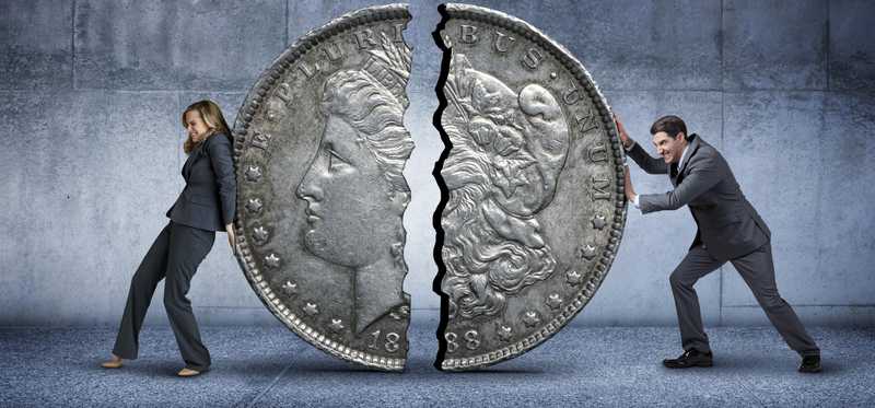 Woman and man pushing a coin split in half back together