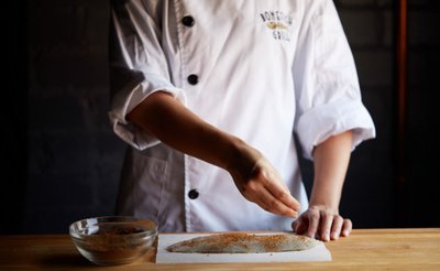 Food being prepared by a chef.