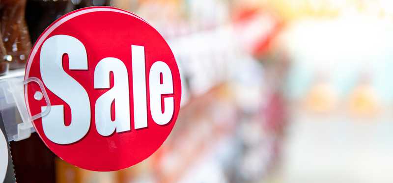 Sale sign in a store aisle.