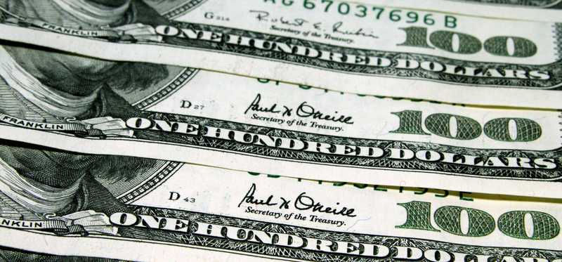 A neat row of hundred dollar bills.