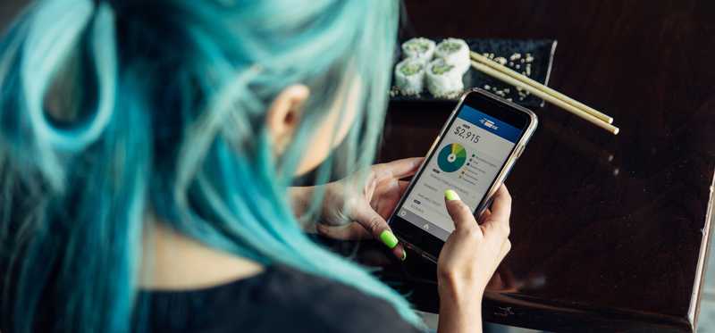 Person checking finances on phone.