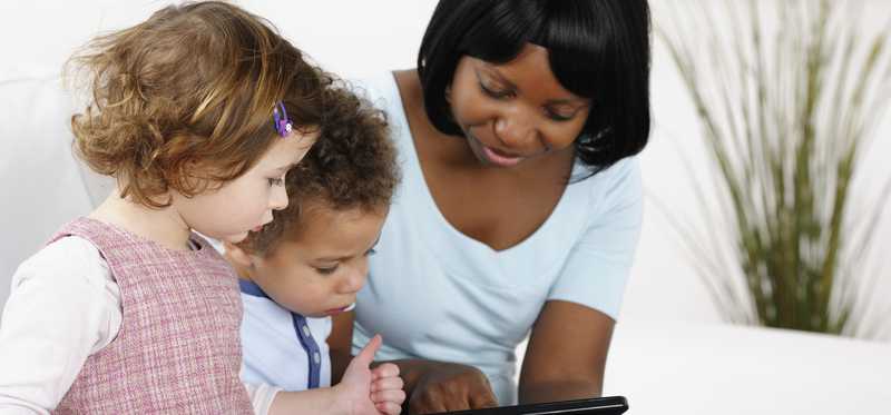 A woman with two young children.