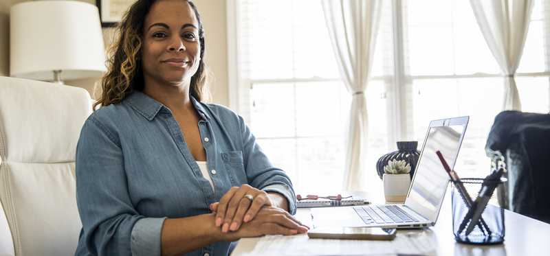 Person sitting at desk in home office.