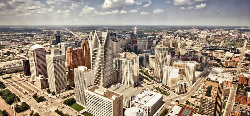 City of Detroit with clouds above it.