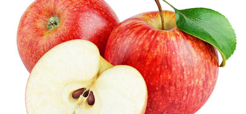 Two whole and one cut red apple.